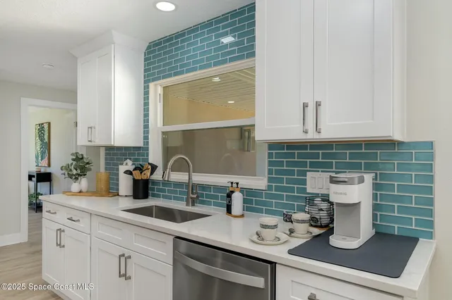 a kitchen with a sink and cabinets