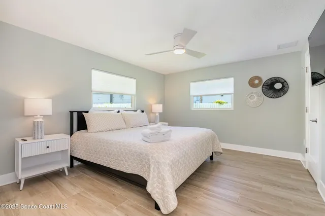 a bedroom with bed and a window