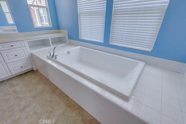 a bathroom with a sink and vanity