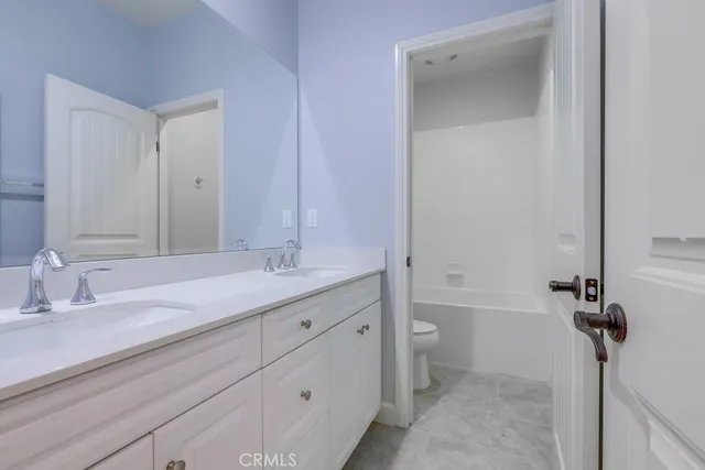 a view of swimming pool with palm trees
