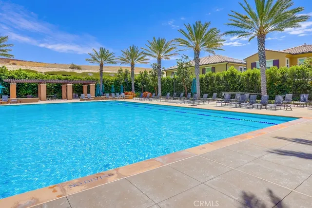 a view of a patio with a table chairs and a yard