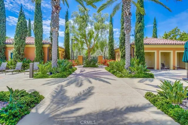 a view of a swimming pool with a patio and a yard
