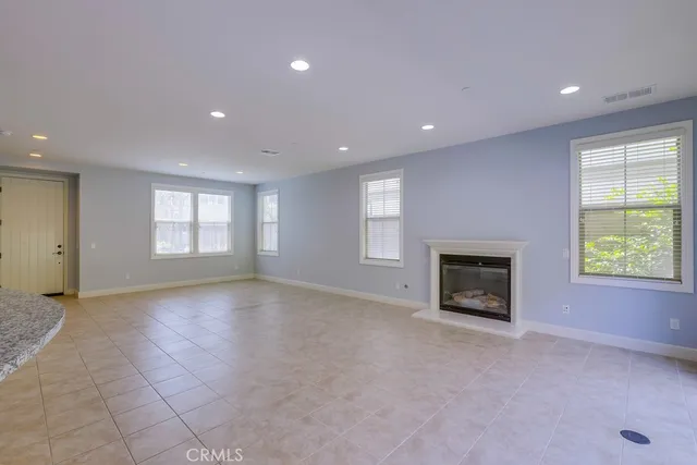 an empty room with windows and pillars in it