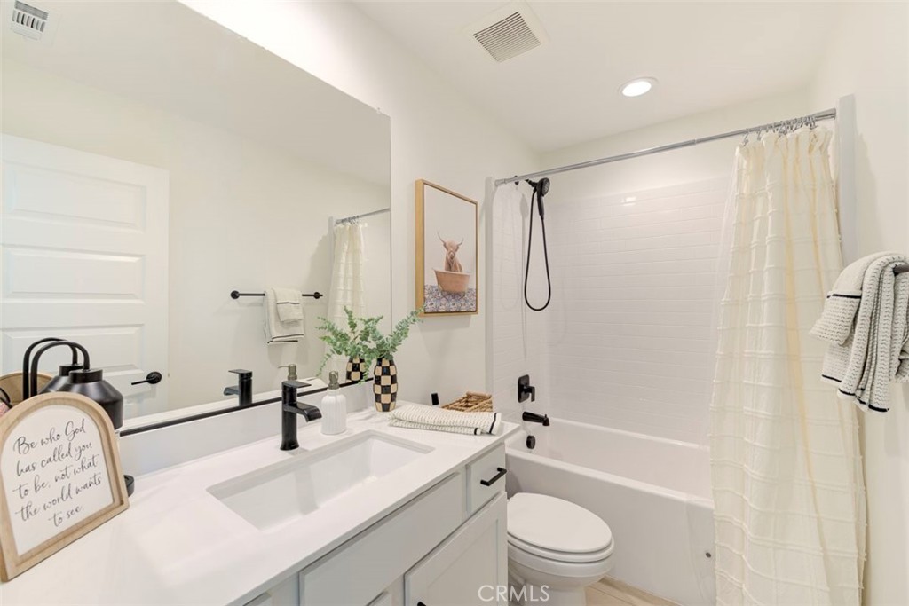 861 Cornelia Way Rancho Mission Viejo, CA 92694 - Photo 18 of 39 a bathroom with a sink a toilet and shower