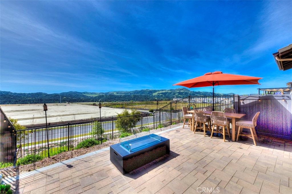 861 Cornelia Way Rancho Mission Viejo, CA 92694 - Photo 21 of 39 an outdoor space with furniture and umbrella