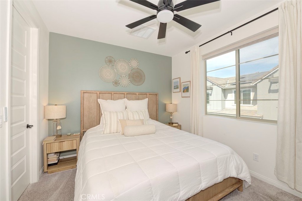 861 Cornelia Way Rancho Mission Viejo, CA 92694 - Photo 10 of 39 a bedroom with a bed and a painting on the wall