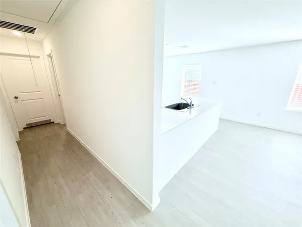 a view of a room with water heater and painted walls