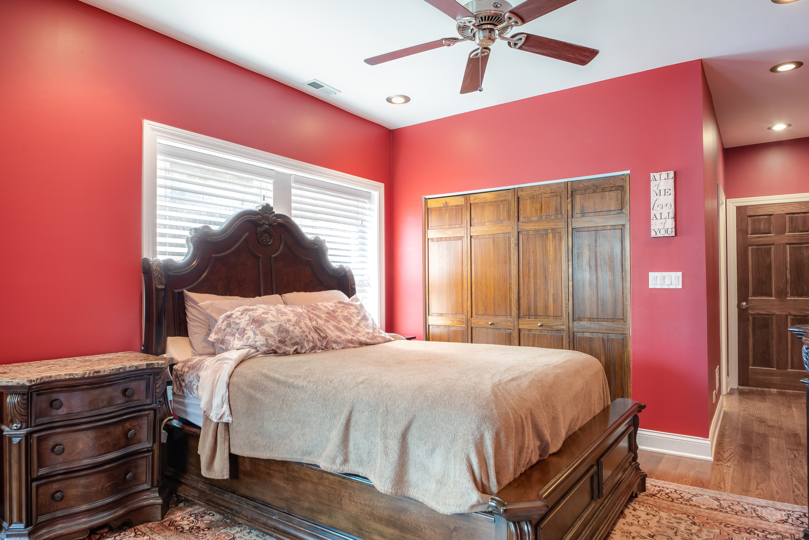6967 North Sheridan Road, Unit 1 Chicago, IL 60626 - Photo 11 of 21 a bedroom with a bed and a chandelier