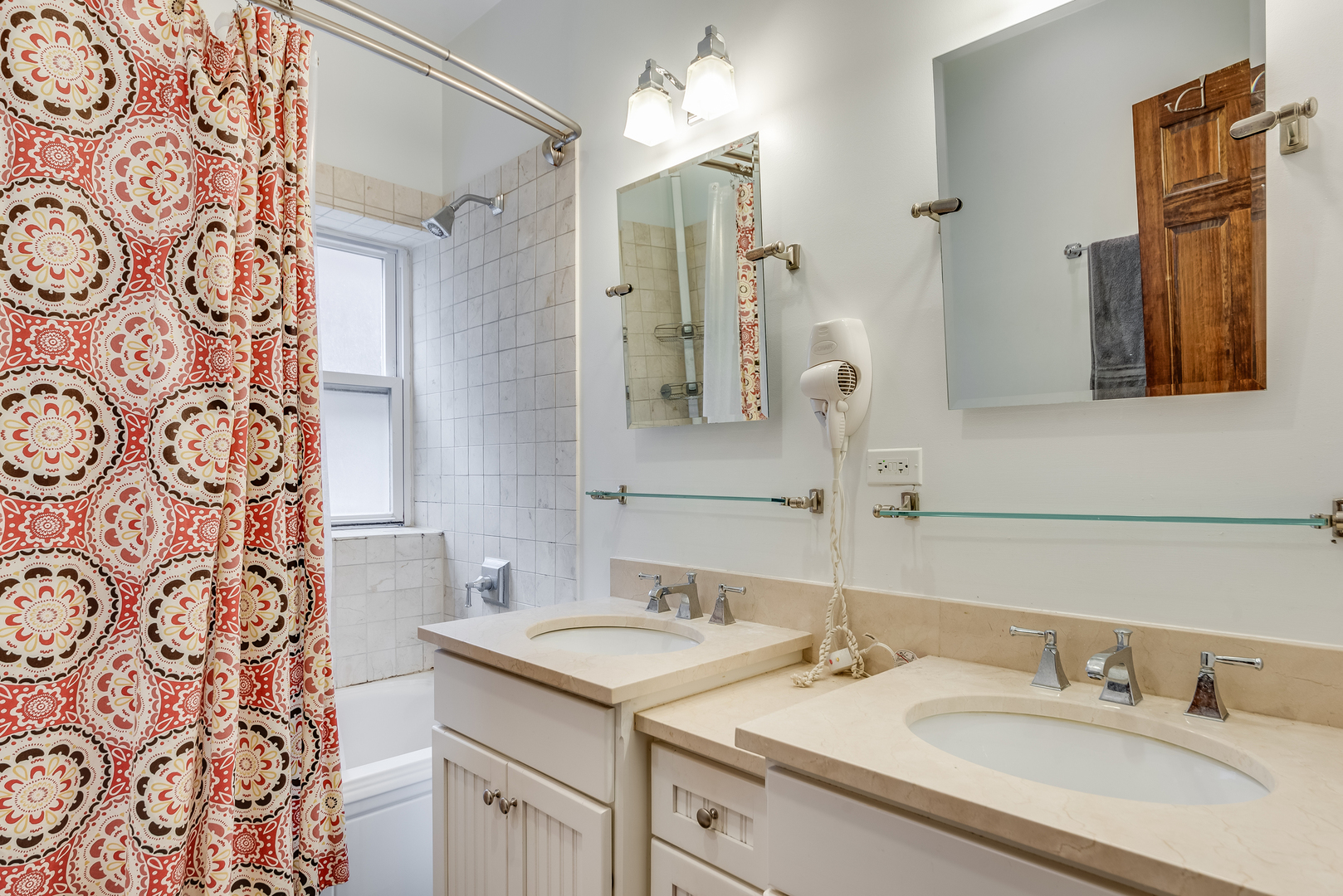 6967 North Sheridan Road, Unit 1 Chicago, IL 60626 - Photo 12 of 21 a bathroom with a sink and a mirror