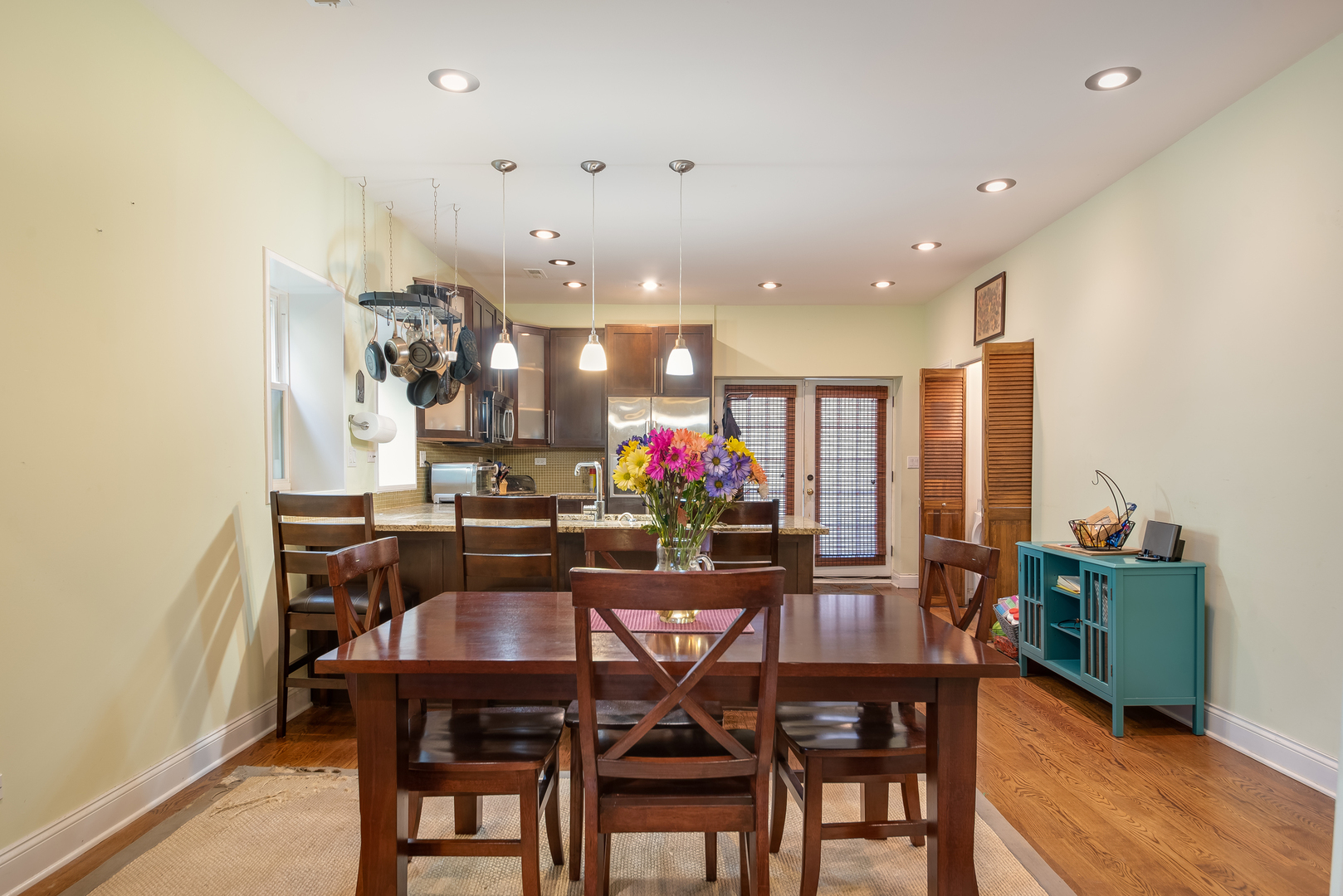6967 North Sheridan Road, Unit 1 Chicago, IL 60626 - Photo 14 of 21 a dining room with furniture and wooden floor