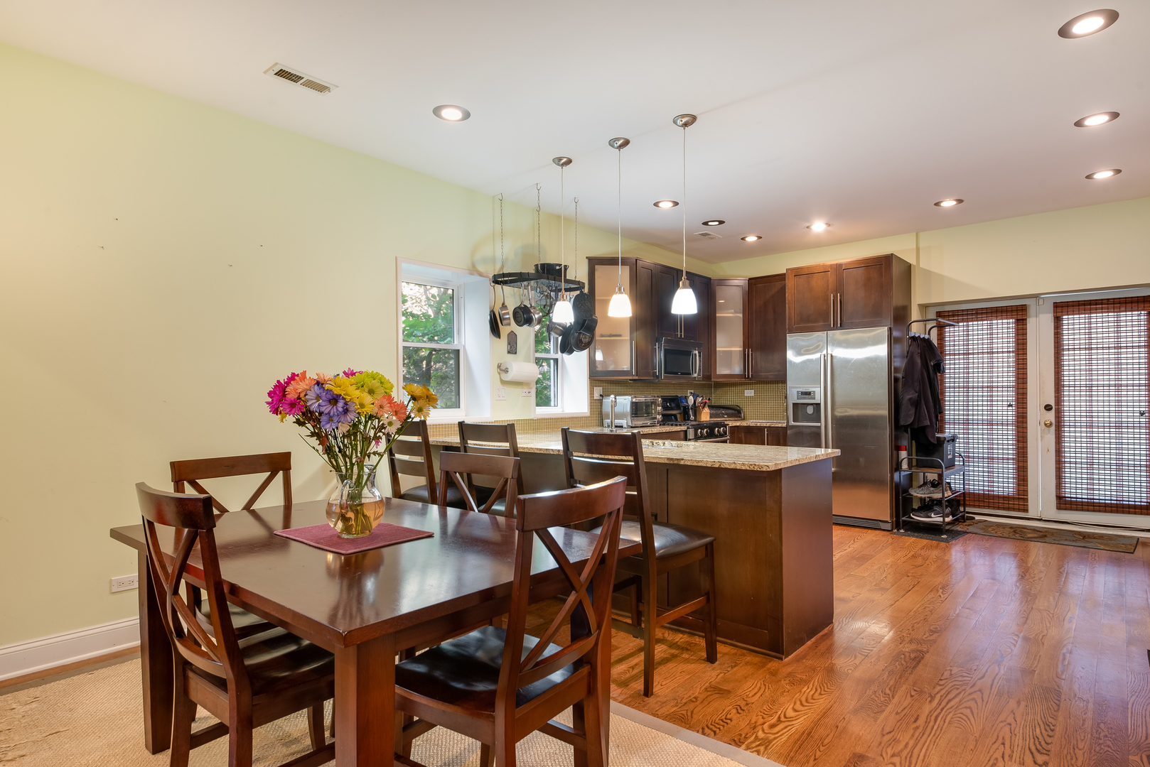 6967 North Sheridan Road, Unit 1 Chicago, IL 60626 - Photo 15 of 21 a view of a dining room with furniture and wooden floor