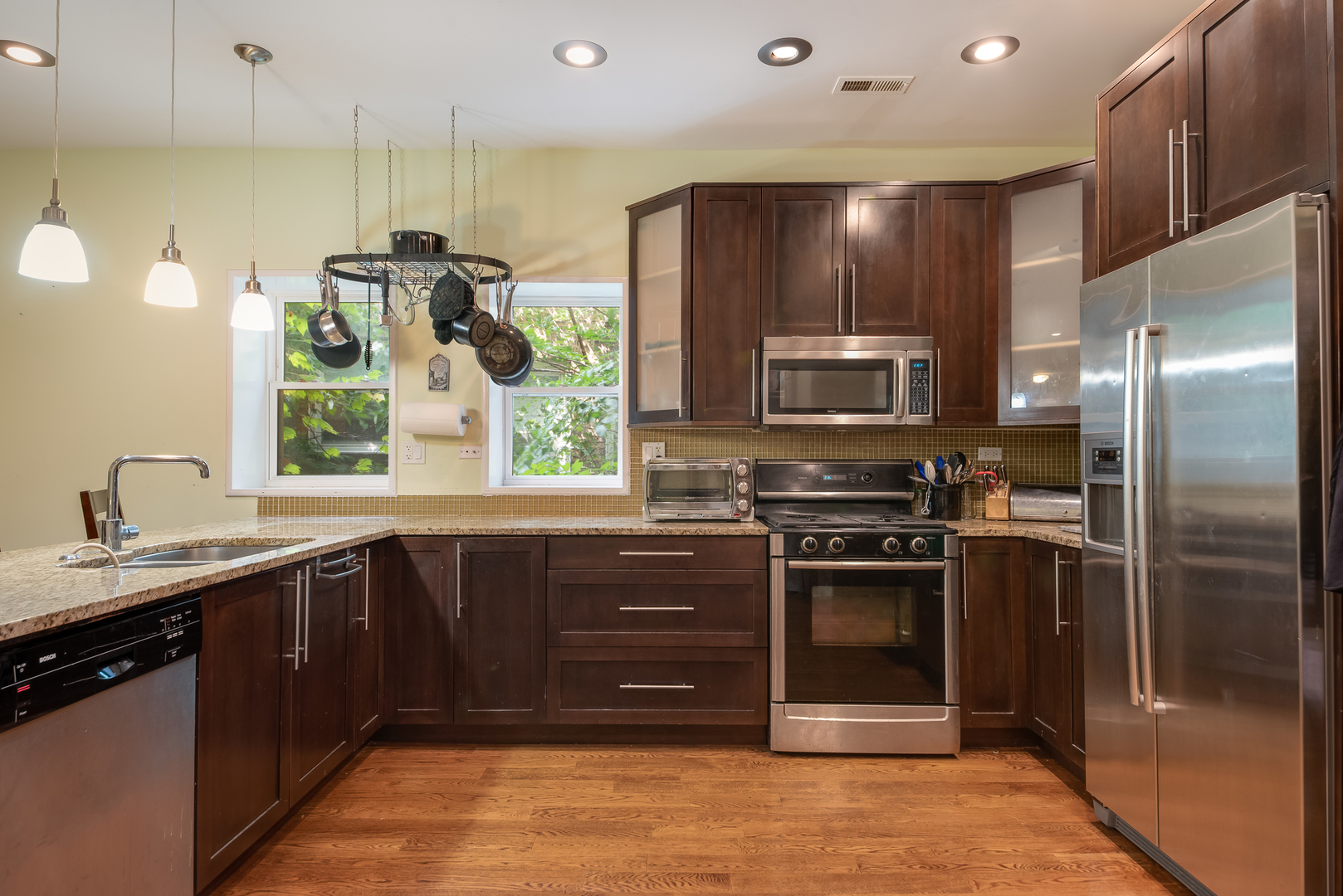 6967 North Sheridan Road, Unit 1 Chicago, IL 60626 - Photo 16 of 21 a kitchen with stainless steel appliances granite countertop a refrigerator and a sink