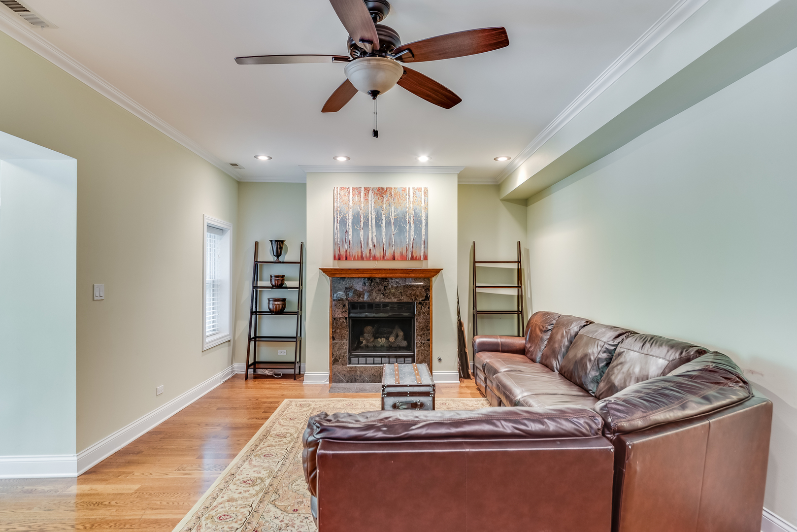 6967 North Sheridan Road, Unit 1 Chicago, IL 60626 - Photo 3 of 21 a living room with furniture and a fireplace