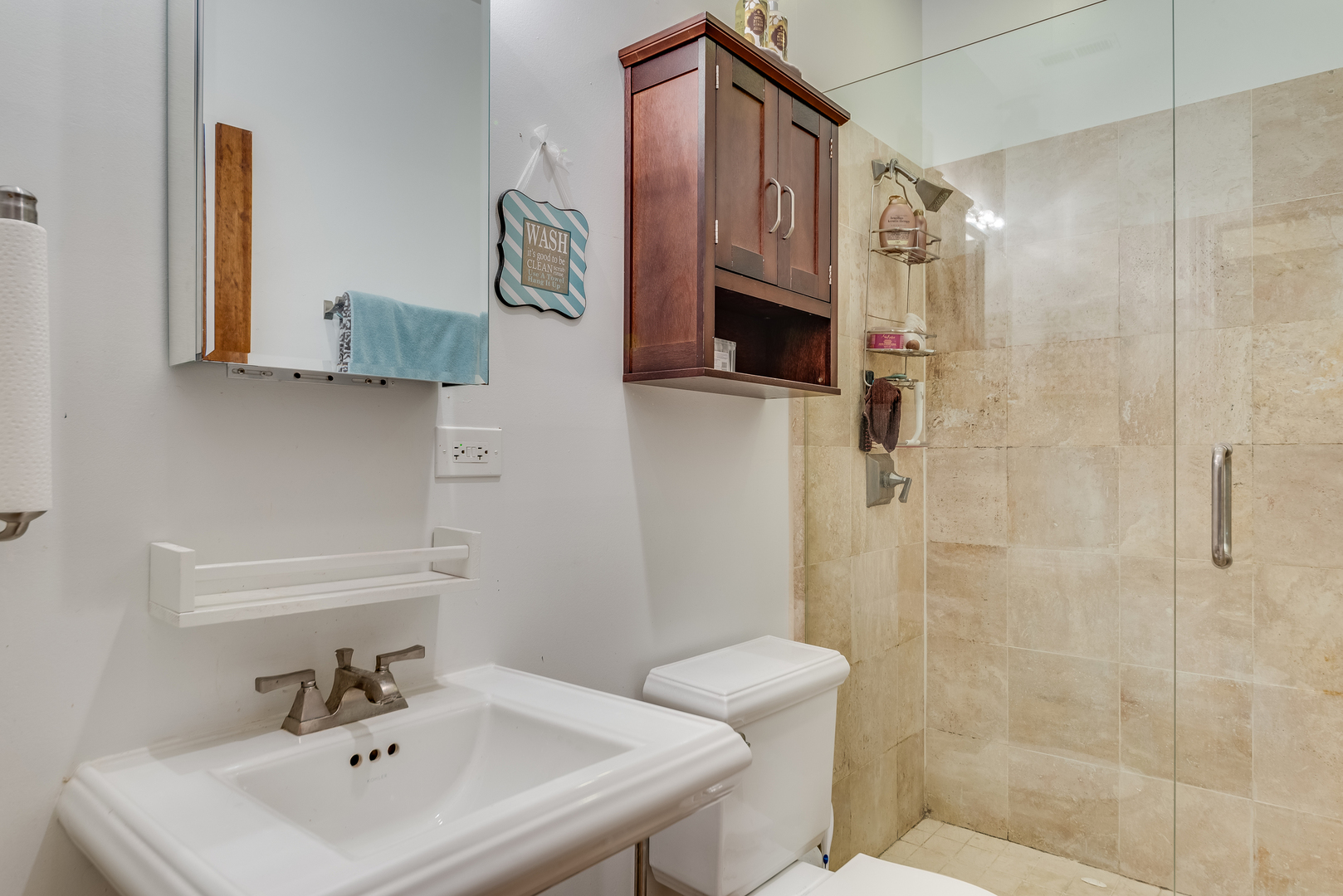 6967 North Sheridan Road, Unit 1 Chicago, IL 60626 - Photo 9 of 21 a bathroom with a sink a toilet and shower
