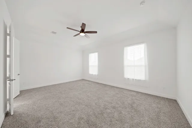 a view of empty room with windows