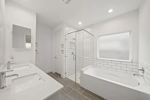 a bathroom with a bathtub and a sink