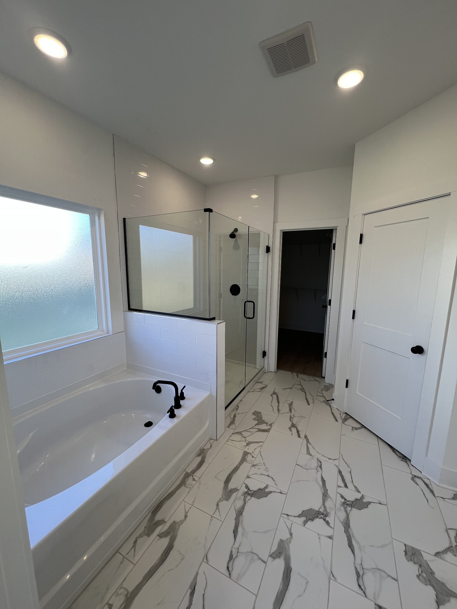 304 Strong Street Columbia, TN 38401 - Photo 12 of 49 a bathroom with a bathtub and a shower