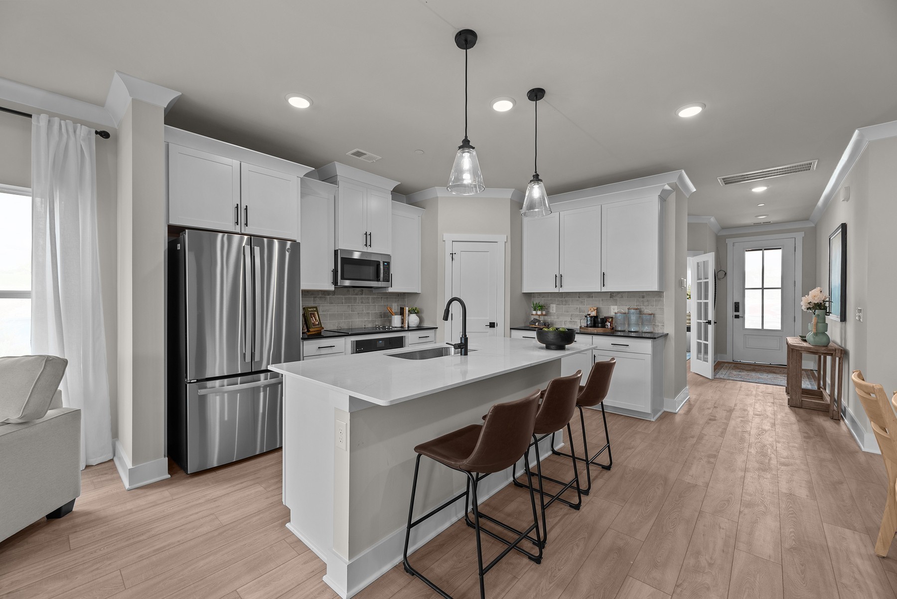 304 Strong Street Columbia, TN 38401 - Photo 23 of 49 a kitchen with stainless steel appliances granite countertop a refrigerator a sink dishwasher a stove and a refrigerator with wooden floor