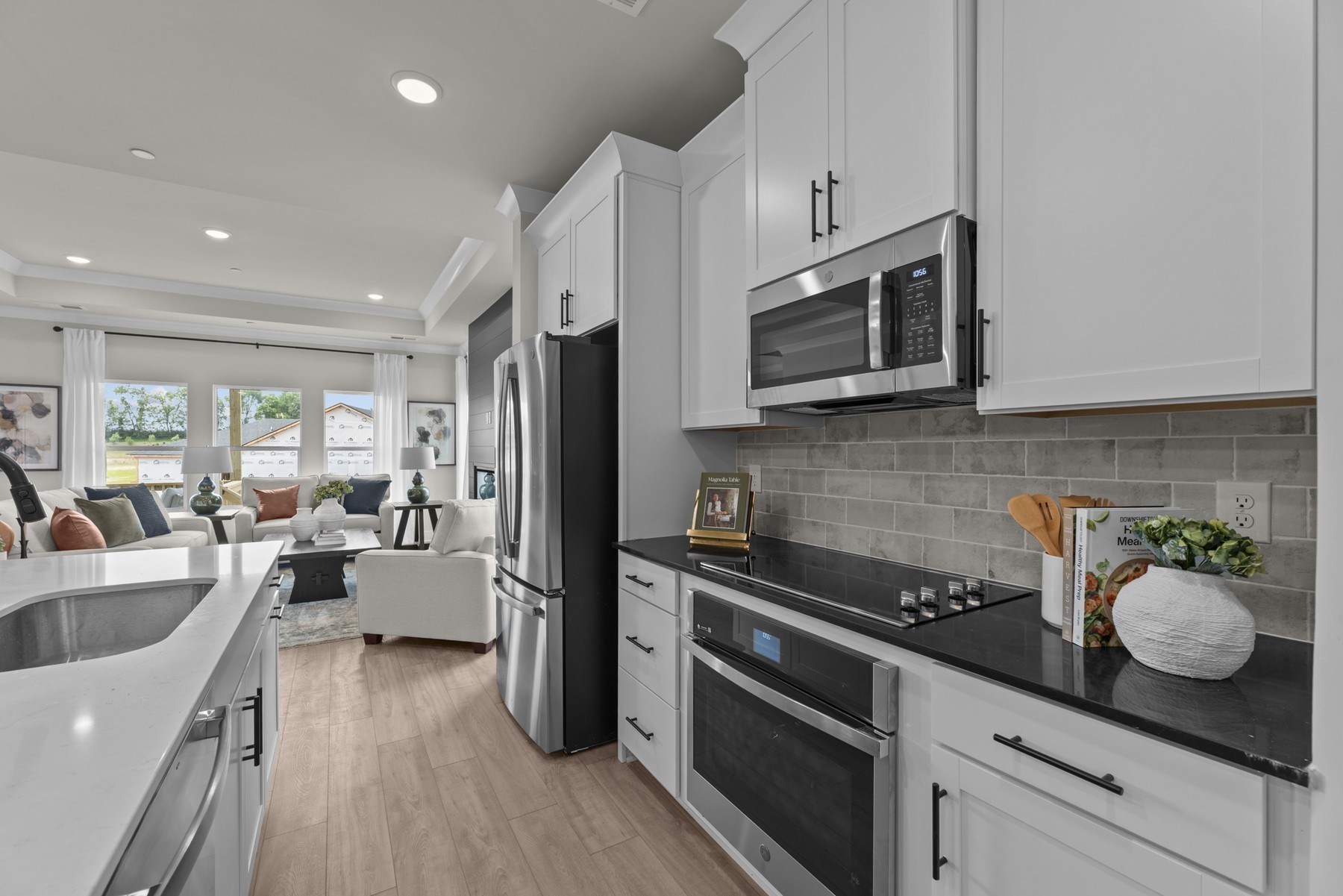 304 Strong Street Columbia, TN 38401 - Photo 24 of 49 a kitchen with stainless steel appliances granite countertop a sink stove and microwave