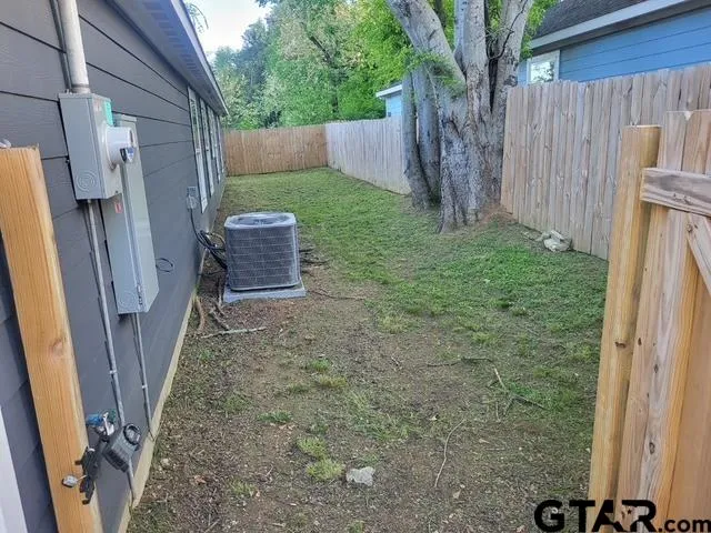 a backyard of a house with lots of green space