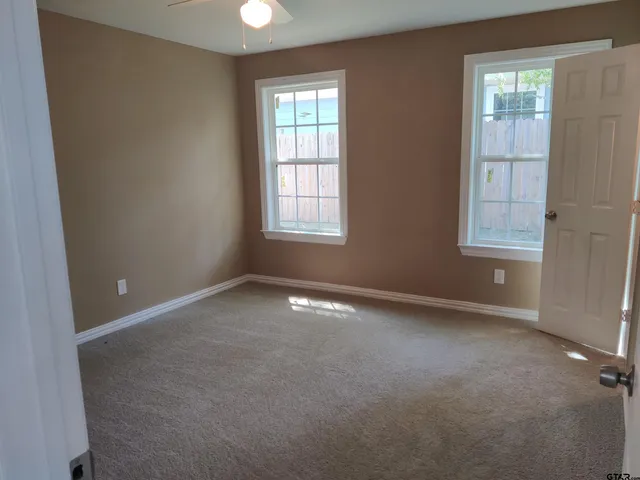an empty room with windows