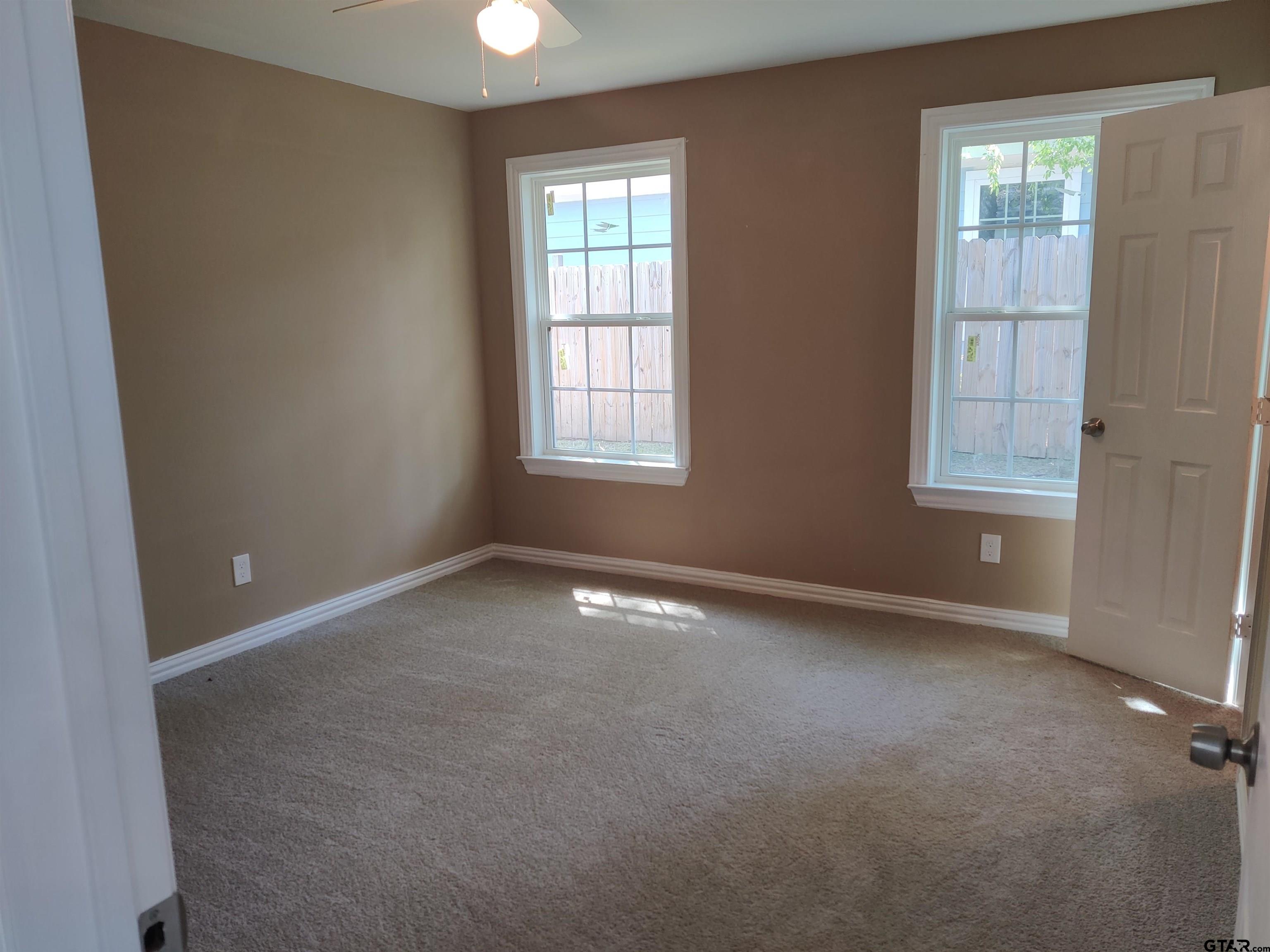 208 Lenox Pittsburg, TX 75686 - Photo 7 of 19 an empty room with windows