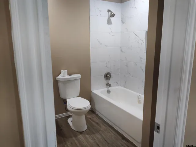 a bathroom with a toilet and a sink