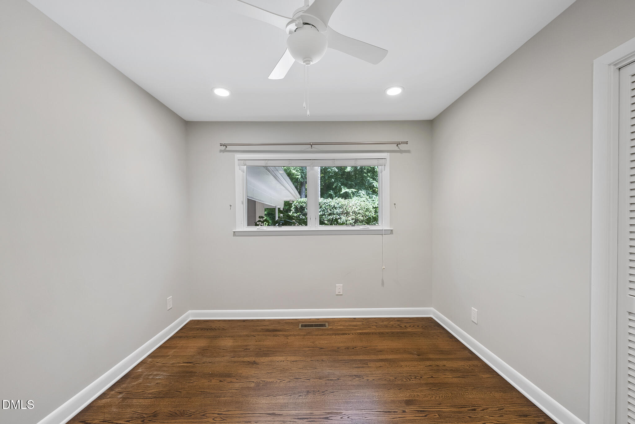 1605 Ridge Road Raleigh, NC 27607 - Photo 25 of 34 an empty room with wooden floor and windows
