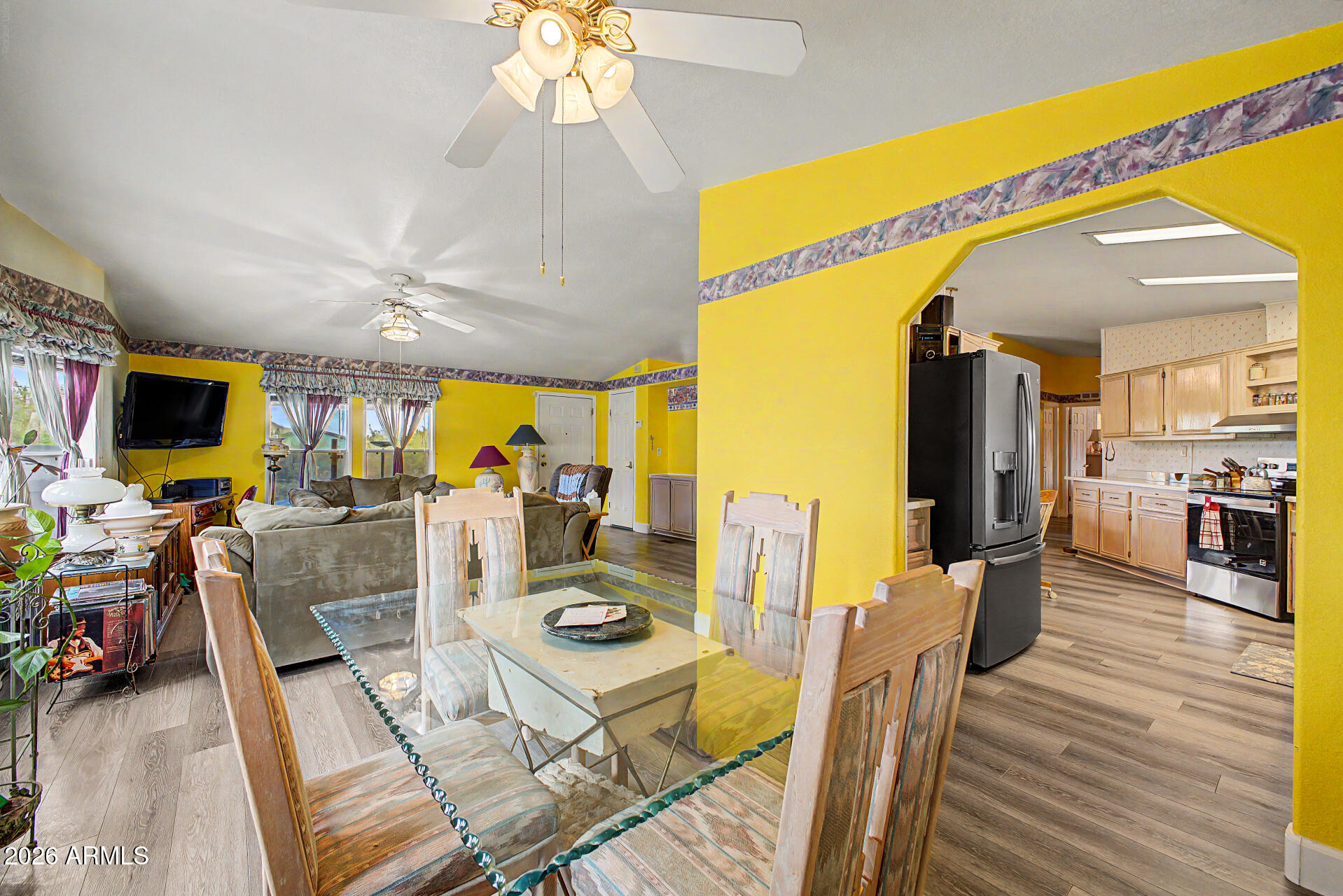 2548 South Val Vista Road Apache Junction, AZ 85119 - Photo 13 of 29 a view of a dining room with furniture a chandelier and wooden floor