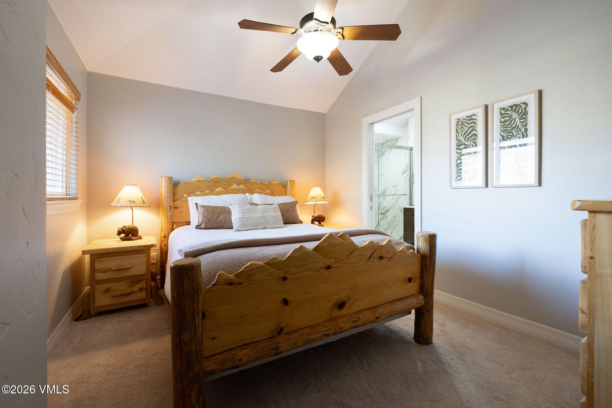 99 Castle Peak Close, Unit B Edwards, CO 81632 - Photo 16 of 35 a bedroom with a bed and a chandelier