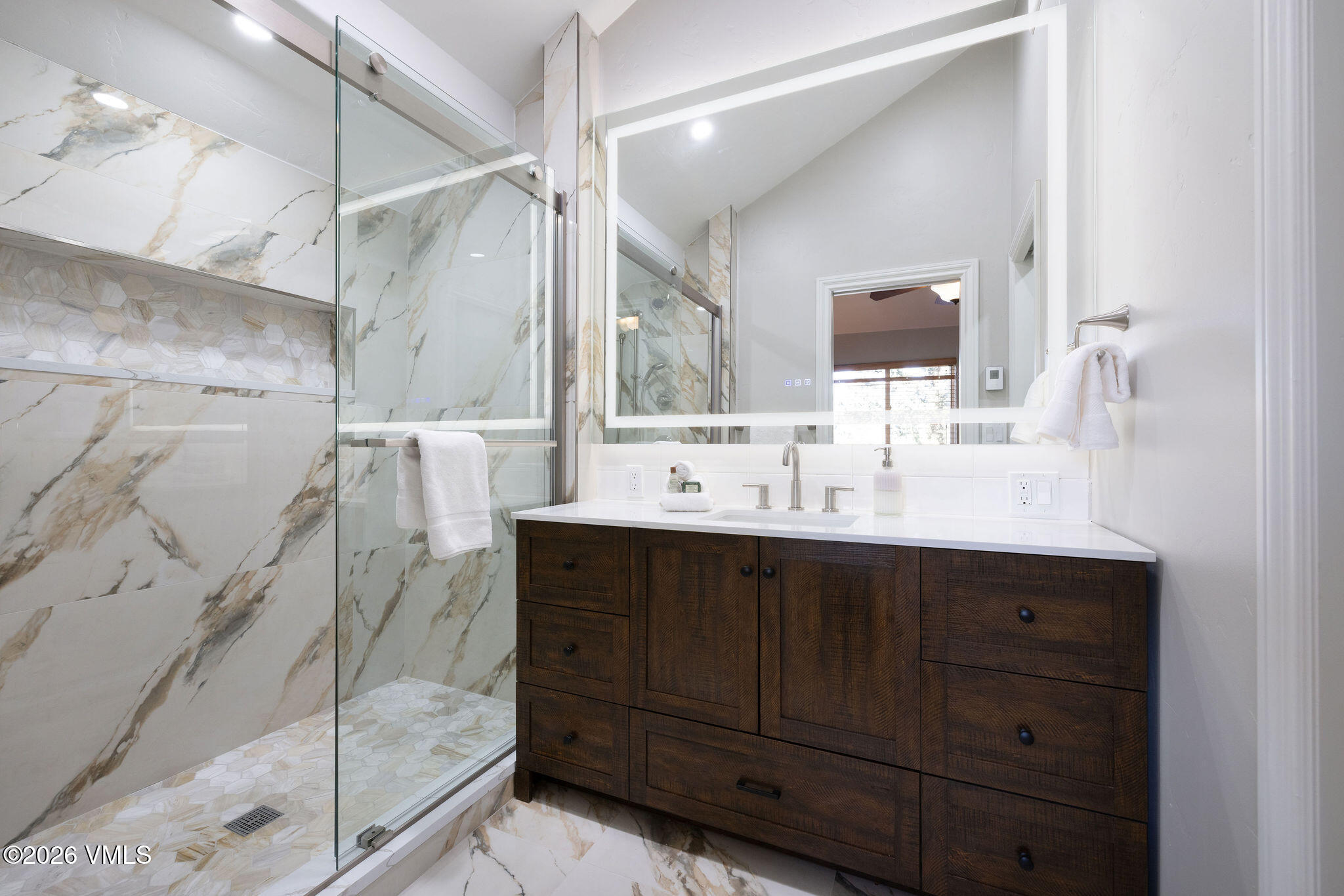 99 Castle Peak Close, Unit B Edwards, CO 81632 - Photo 17 of 35 a bathroom with a sink and mirror