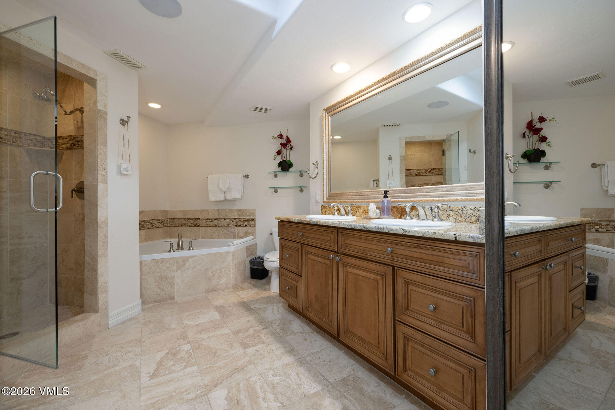 99 Castle Peak Close, Unit B Edwards, CO 81632 - Photo 20 of 35 a bathroom with a granite countertop sink mirror and bathtub