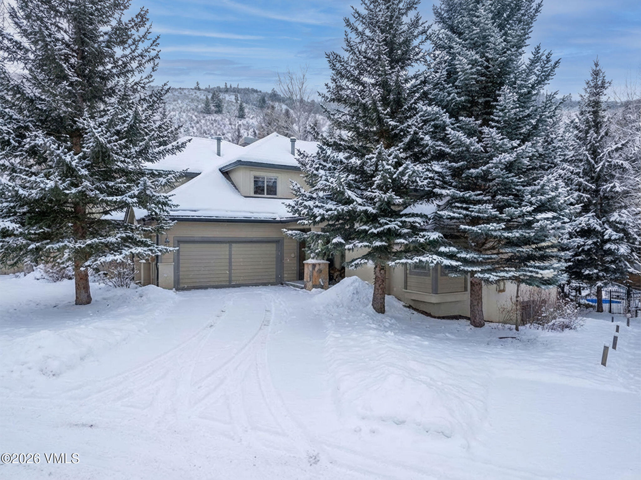 99 Castle Peak Close, Unit B Edwards, CO 81632 - Photo 27 of 35 a big house with large trees