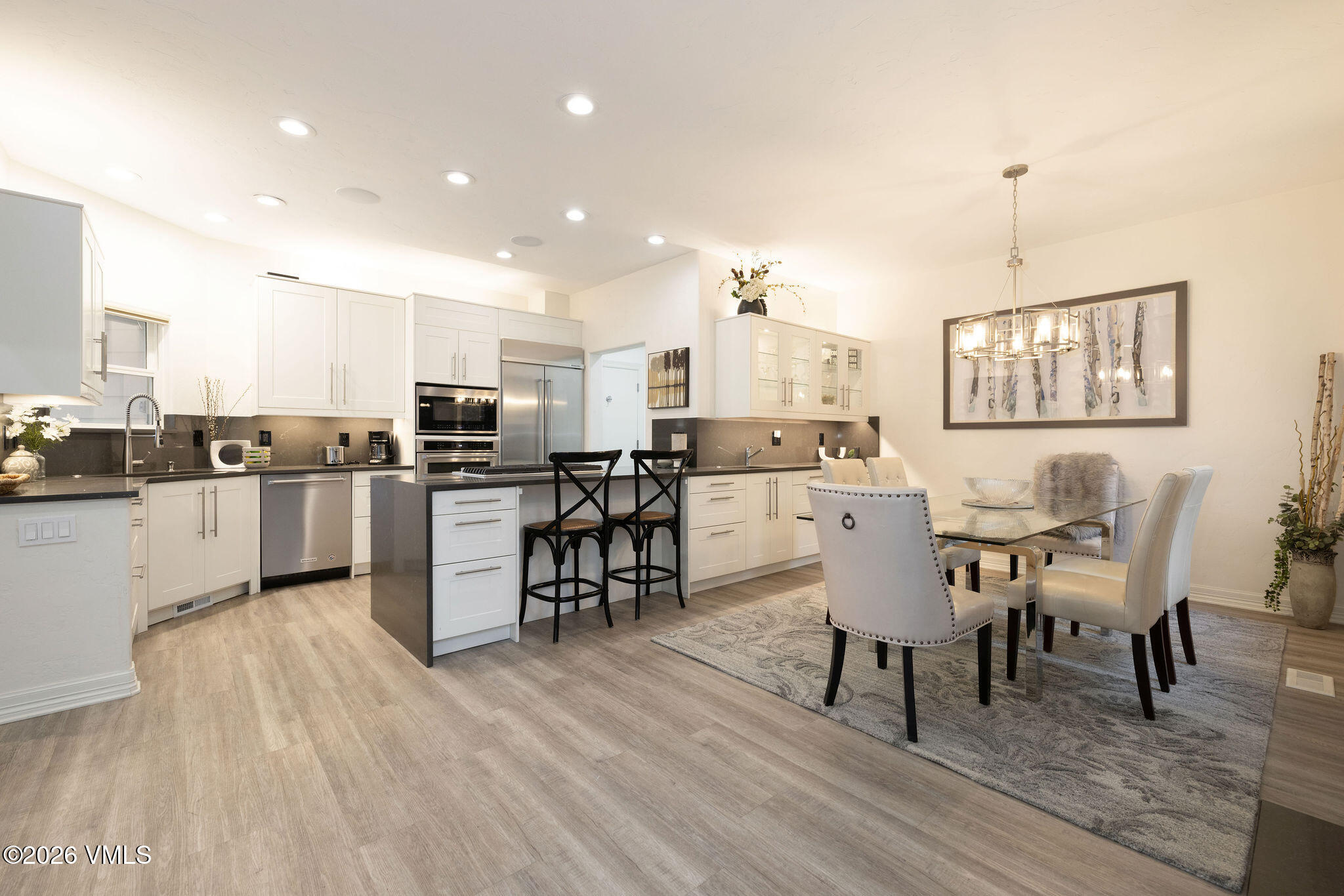 99 Castle Peak Close, Unit B Edwards, CO 81632 - Photo 4 of 35 a view of kitchen with cabinets table and chairs