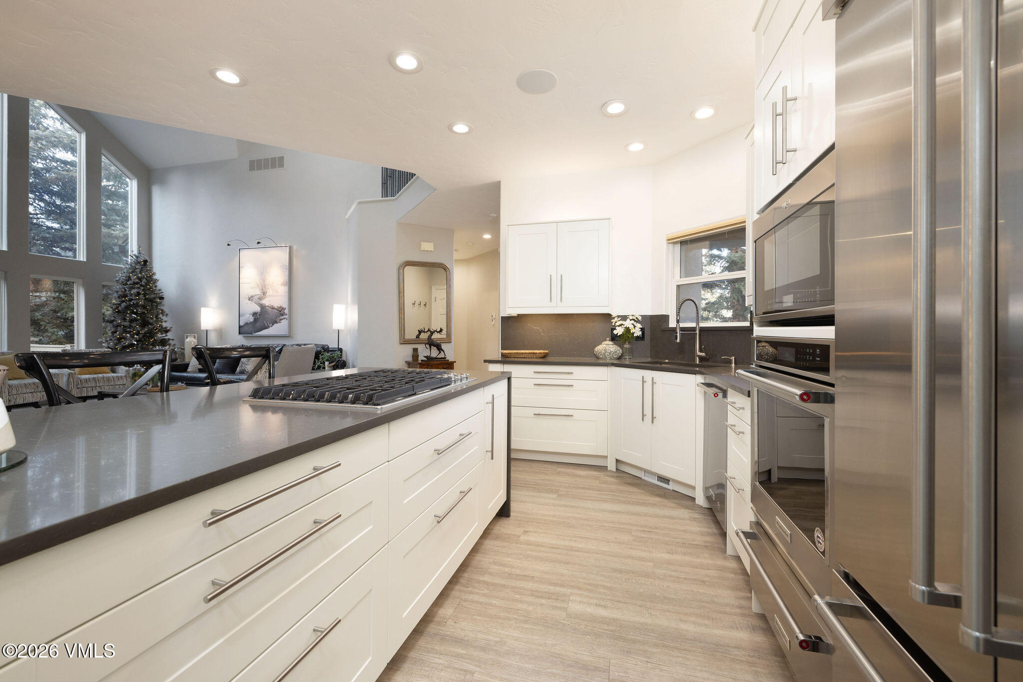 99 Castle Peak Close, Unit B Edwards, CO 81632 - Photo 6 of 35 a large kitchen with granite countertop a large counter top stainless steel appliances and cabinets