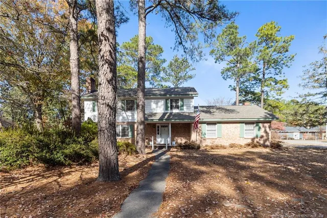 a view of a large building with a tree in the background