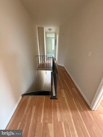 a view of wooden floor and staircase