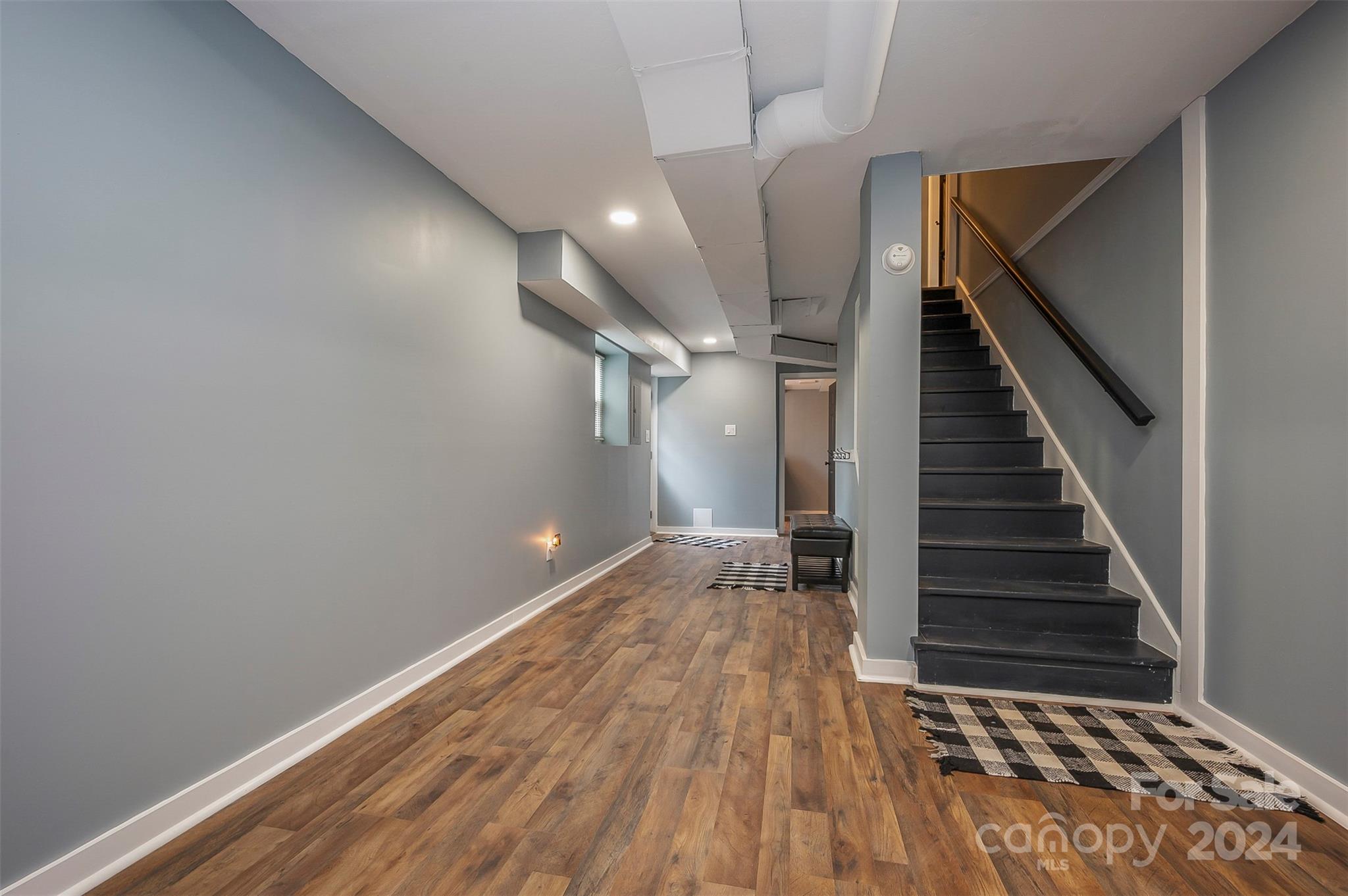 207 Smith Grove Road Forest City, NC 28043 - Photo 18 of 37 wooden floor in an empty room with stairs