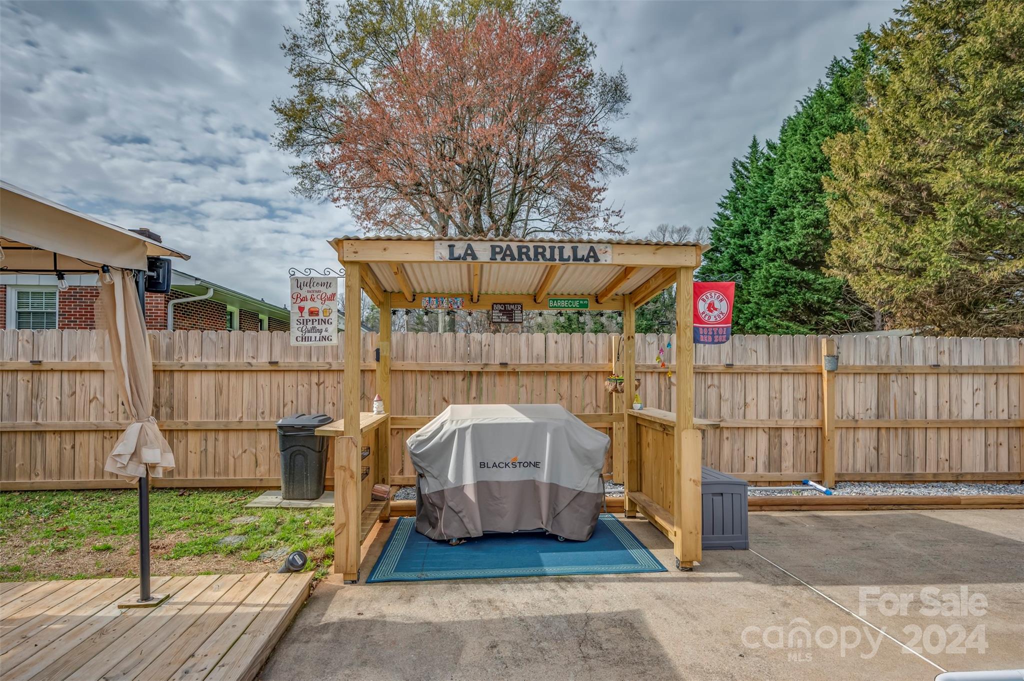 207 Smith Grove Road Forest City, NC 28043 - Photo 27 of 37 a small pool is sitting in front of a brick house with wooden fence