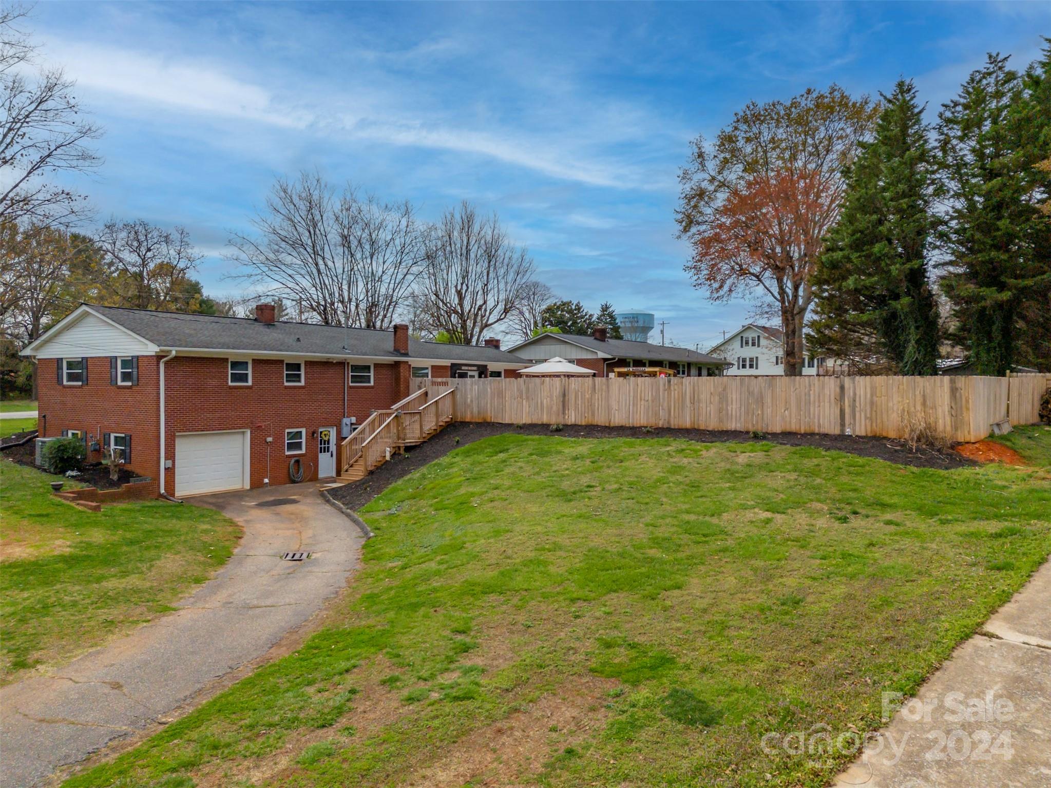 207 Smith Grove Road Forest City, NC 28043 - Photo 32 of 37 a view of a house with backyard and a tree
