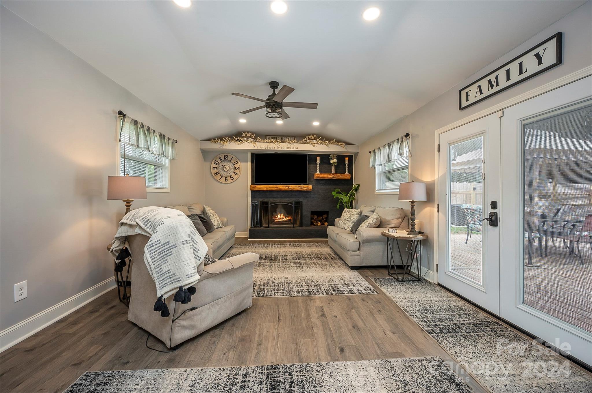 207 Smith Grove Road Forest City, NC 28043 - Photo 5 of 37 a living room with furniture fireplace and a table