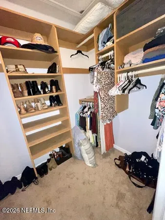 a view of staircase with a chair