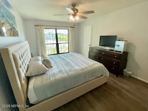 a living room with furniture and a mirror
