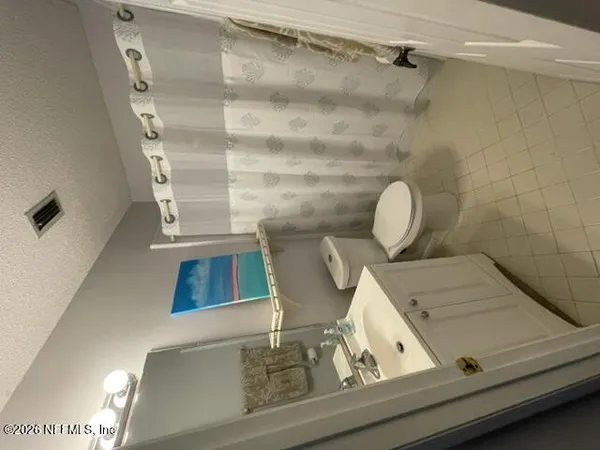 a view of living room with furniture and a window