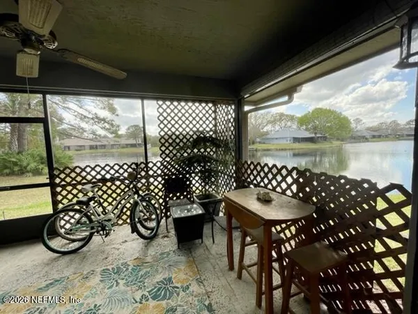 a view of a chairs and table in the patio