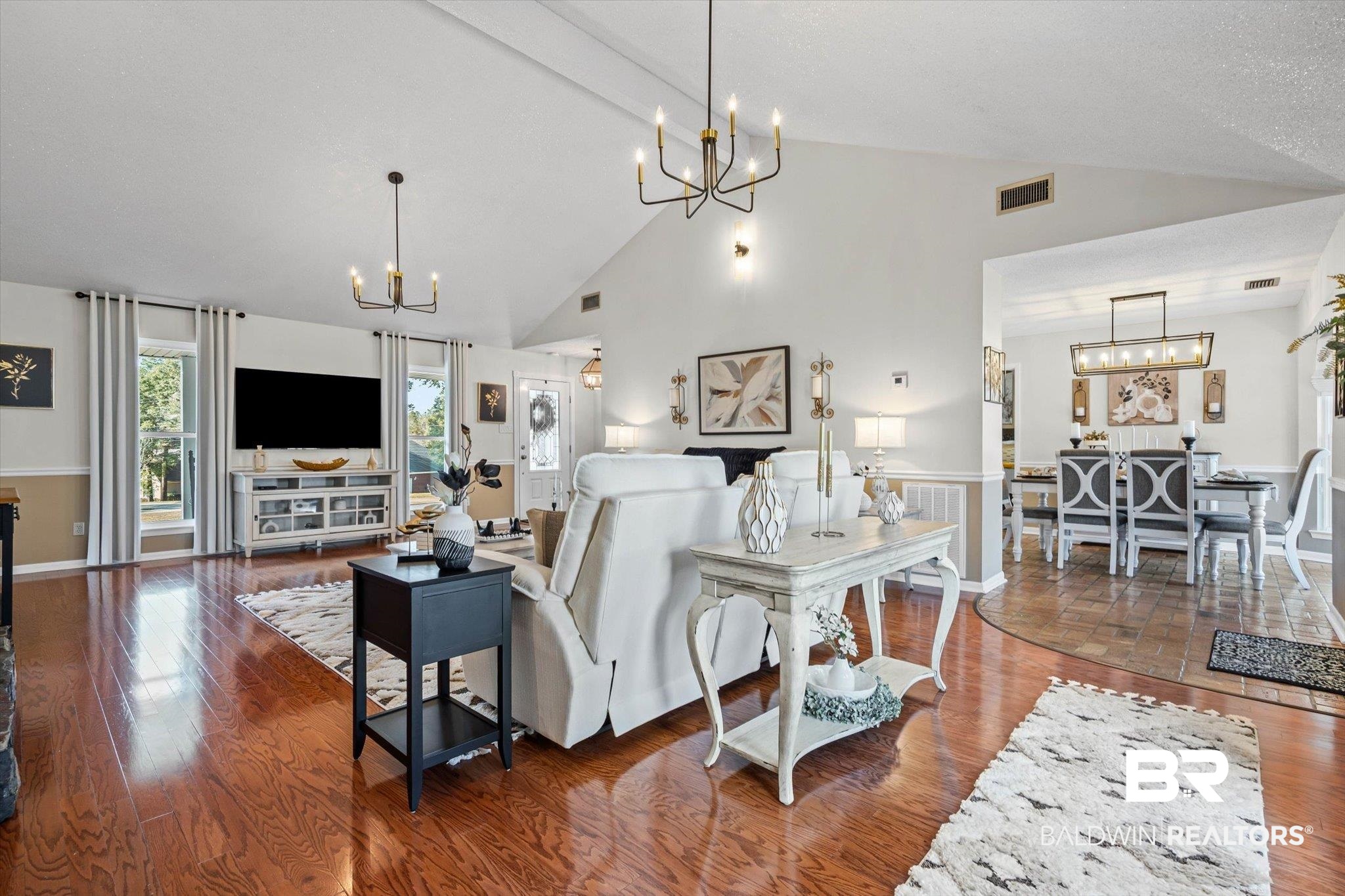 4567 Pine Avenue Saraland, AL 36571 - Photo 6 of 48 Living room with a chandelier, dark wood finished floors, and high vaulted ceiling