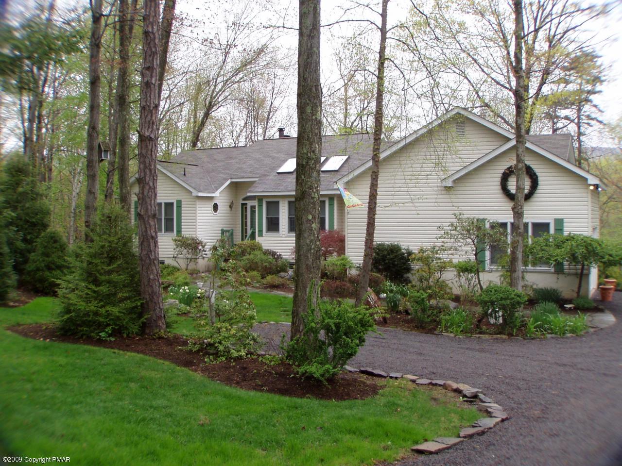 Devil's Hole Road Cresco, PA 18326 - Photo 1 of 27 a front view of a house with a yard and potted plants