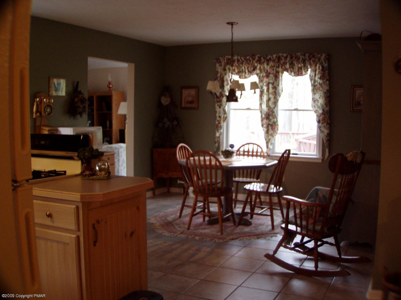 Devil's Hole Road Cresco, PA 18326 - Photo 11 of 27 a view of a dining room with furniture window and outside view
