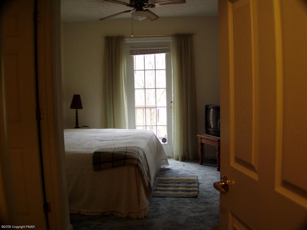 Devil's Hole Road Cresco, PA 18326 - Photo 19 of 27 a bedroom with a bed and a window