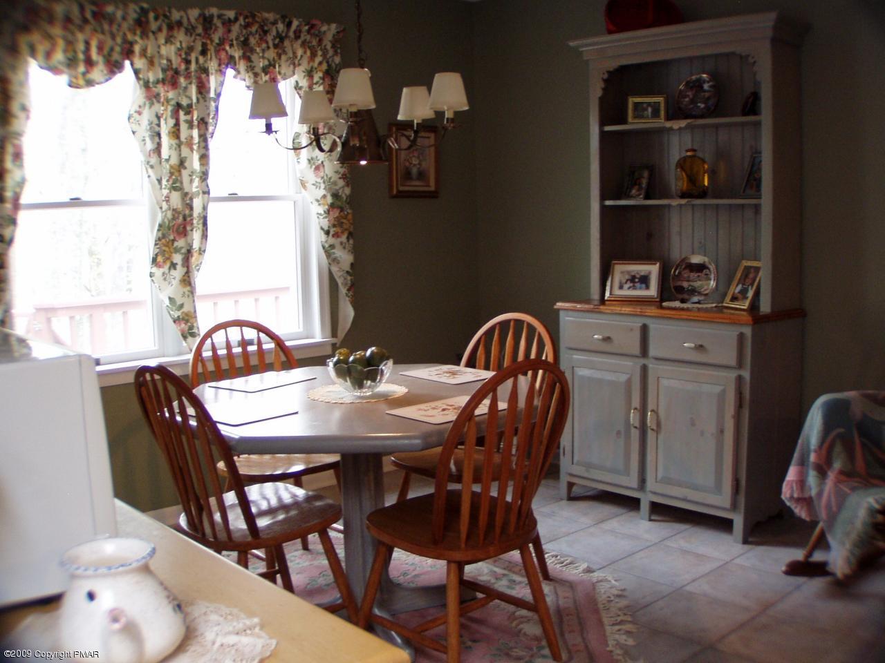 Devil's Hole Road Cresco, PA 18326 - Photo 10 of 27 a view of a dining room with furniture and chandelier